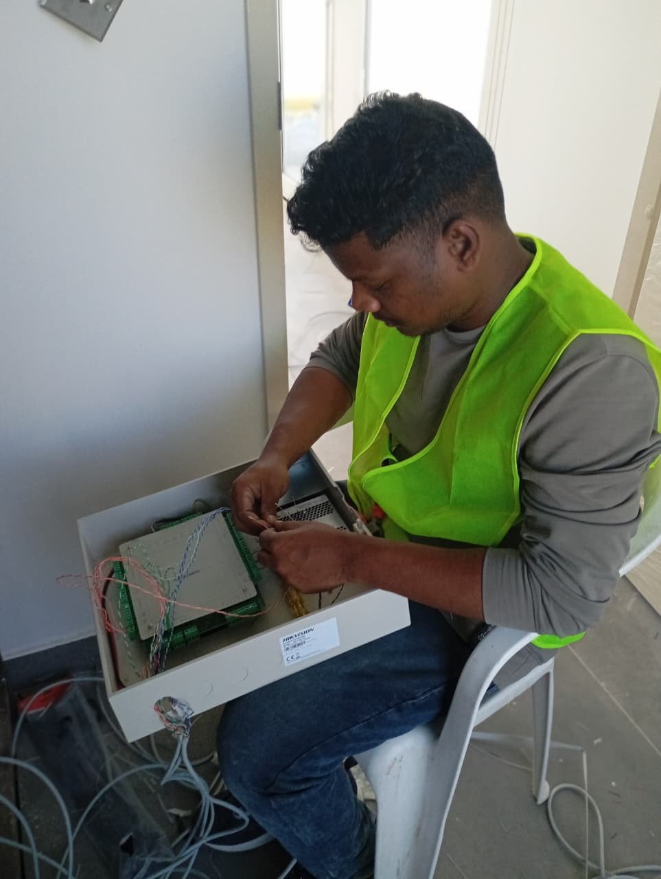 Hikvision door controller wiring installation Dubai UAE — access control engineer